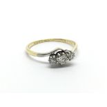 A Vintage 18carat gold ring set with three diamond