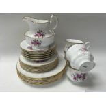 A bone China tea set with floral design.