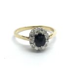 An 18ct gold sapphire and diamond cluster ring, ap