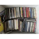 A box of CDs by various artists including