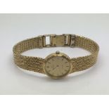 A ladies gold tone Omega Deville watch.