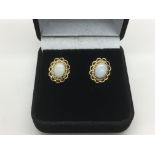 A pair of 9ct gold opal earrings, approx 2g.
