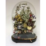 A late Victorian display of simulated fruit under