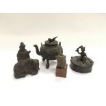 Four small Oriental bronzed items including a budd