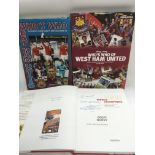A signed Geoff Hurst '1966 World Champions' hardback book plus two West Ham Who's Who books (3).