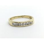 An 18ct gold seven stone half eternity diamond rin