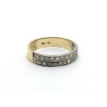 An 18carat gold ring set with two rows of small di