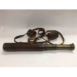 A circa 1900s leather cased telescope by Broadhurs