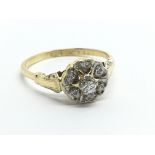 An 18ct gold seven stone diamond cluster ring, app