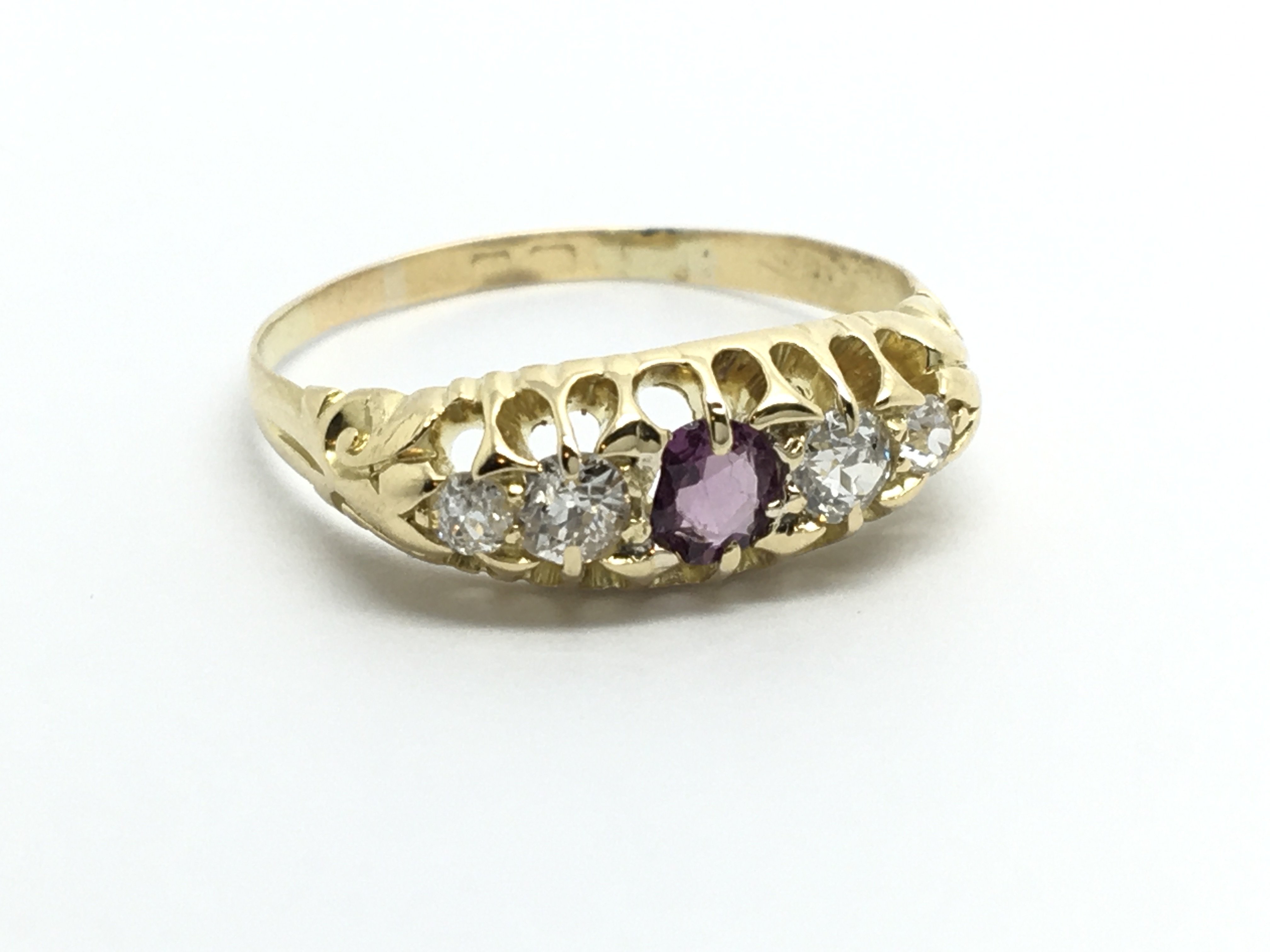 A vintage 18ct gold ring set with four diamonds an