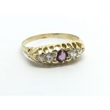 A vintage 18ct gold ring set with four diamonds an