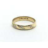 An 18carat gold ring set with six diamonds ring si