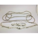 Three silver necklace and bracelet sets.