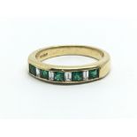 An 18ct yellow gold half eternity emerald and diamond ring, approx ring size N