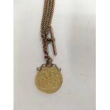 A 9 ct gold watch chain with T bar 20 grams with attached 1915 Full sovereign.