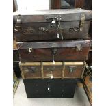 4 large antique shipping trunks.