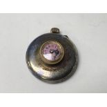 A small button hole fob watch
