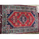 A good quality Persian wool rug 195 x 124cm
