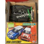 Mini challenge micro scalextric, plus an additional box of standard track.