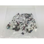 A bag of loose mixed stones including CZs, rubies, emeralds, sapphires, amethyst and blue topaz,