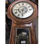A walnut case wall clock the dial with Roman numerals maker T Fattorini Skipton .