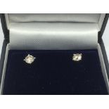 A boxed pair of 18ct white gold four claw set RBC diamonds ear studs, diamonds approx 1.06ct, approx