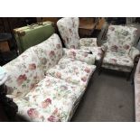 A 3 piece Parker Knoll suite consisting of a 2 seater and 2 armchairs.