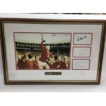 A framed and glazed signed England World Cup 1966 photographic display, signed by Bobby Charlton,