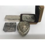 A collection of three small silver boxes and one other plated box with raised decoration of a dog .
