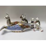 A collection of twenty boxed royal crown derby figures including collectors guild llama , puffin