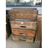 Four vintage wooden bottle crates.