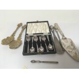 A cased set of sox silver tea spoons a pair of gilded spoons unmarked and silver handled shoe horn