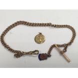 A 9ct gold heavy watch chain with attached silver fob and a 9ct gold St Christopher medallion, total