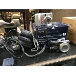 2 boxed Panasonic LUMIX digital cameras plus 1 unboxed Lumix and 1 Nikon.