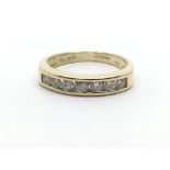 An 18ct yellow gold half eternity ring having a row of seven diamonds, approx 0.50ct, ring size