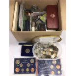 A box of coins to include presentation packs.