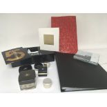 A collection of Chanel comprising empty containers cards a folder dispenser and other oddments.