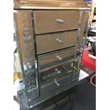 A Glass jewellery Box fitted with five drawers.