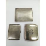 Three silver cigarette cases, various hallmarks.