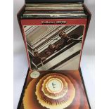 A collection of vinyl records comprising LPs and 7inch singles by various artists including some