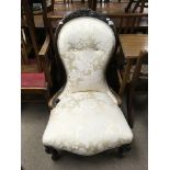 A Victorian button Backed and upholstered chair.