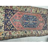 Withdrawn -A Afghan rug with repeat pattern boarded the centr