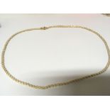 A high grade gold necklace Indistinctly stamped the necklace with an outer woven strand of seed