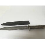 An Early 20th century horn handled knife with steel blade made in Sheffield makers marks worn.