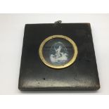 A rare Georgian wax cameo in an ebonised frame.