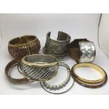 A collection of costume bangles and bracelets.