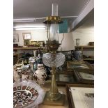 A brass column oil lamp with cut glass bowl