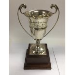 A silver trophy cup on stand, Birmingham 1929, approx total height 26cm and approx weight 249g.
