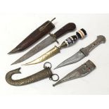 Three knives including a wooden handles knife in carved wooden sheath, a decorated knife in plated