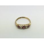 An 18ct gold ring set with rubies and diamonds, approx 2.4g and approx size M-N.